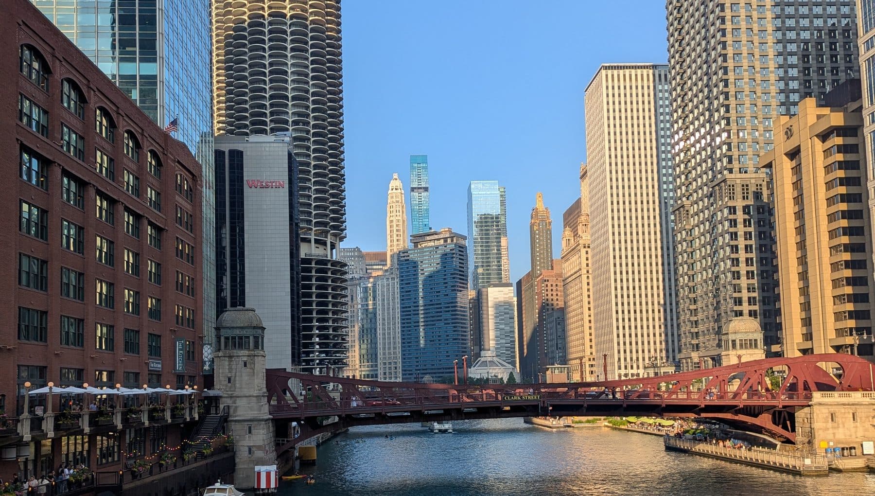 The Chicago River looking west, with Marina City, the red LaSalle Street bridge and the riverwalk.